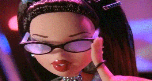 Scene from a commercial of a Bratz doll raising her sunglasses