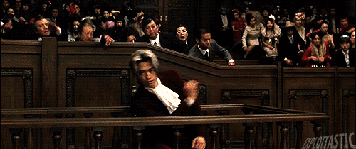 Scene from the live action Phoenix Wright musical where Edgeworth falls down dramatically in shock
